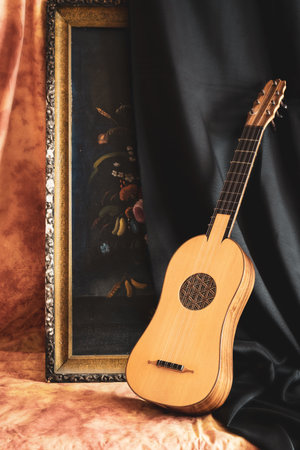 Musical still life in the Renaissance style with renaissance guitarの写真素材