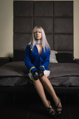 Beautiful young pinup girl in suit of stewardessの写真素材