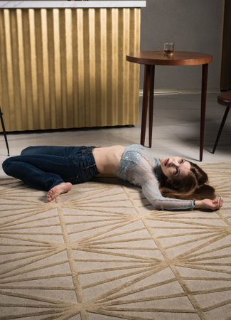 Crime scene imitation. Dead woman lying on a floor.の写真素材
