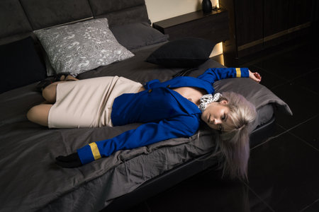 Noir film. Young beautiful flight attendant in uniform being strangled.の写真素材