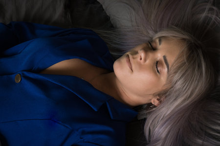 Noir film. Young beautiful flight attendant in uniform being strangled.の写真素材