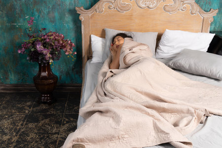 Sexual asian woman in erotic lace underwear sleepingの写真素材