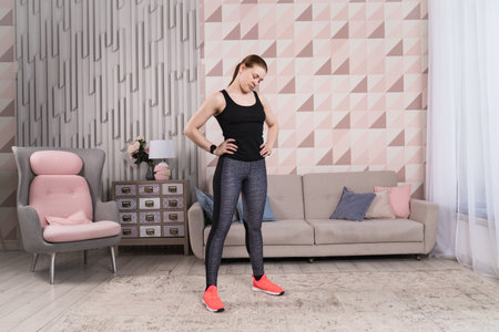 Beautiful woman stretching the muscles of her legsの写真素材