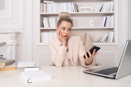 Beautiful business woman speaks by phoneの写真素材