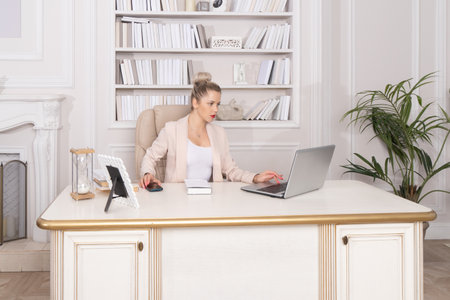 Business woman in the style of Hollywood retro films at the office.の写真素材