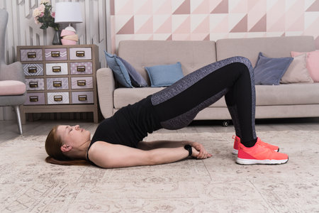 Beautiful woman stretching the muscles of her legsの写真素材