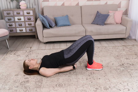 Beautiful woman stretching the muscles of her legsの写真素材