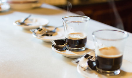 two glasses of coffee alone on an old marble table in a barの写真素材