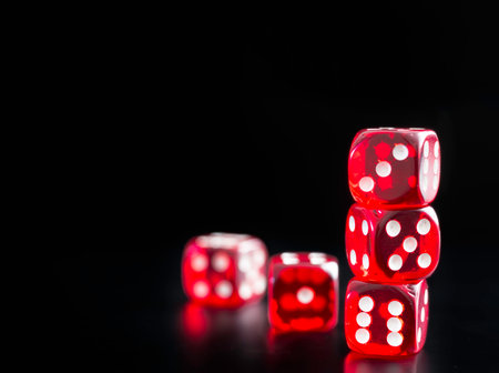 detail of five red dice on black background