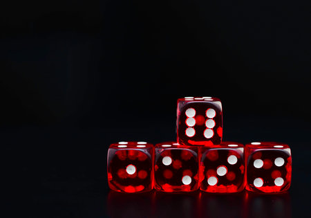 detail of five red dice on black backgroundの写真素材