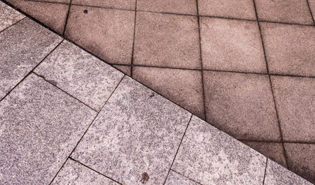 different brick paving stones on a sidewalk background texture.の写真素材