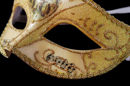 Detail of a carnival mask isolated on black backgroundの写真素材