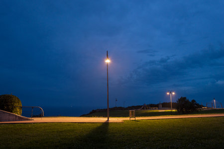 A Night in the Park. Late Autumn Night in the Park. Blue sky and Park Alley. Horizontal Photographyの写真素材