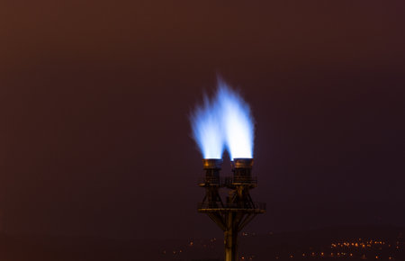 burning blue fire flame on a pipe factory.の写真素材