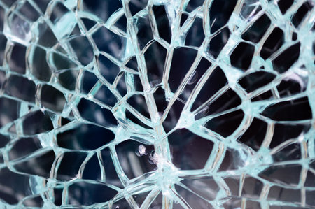 Abstract background of cracked and broken glass of window.