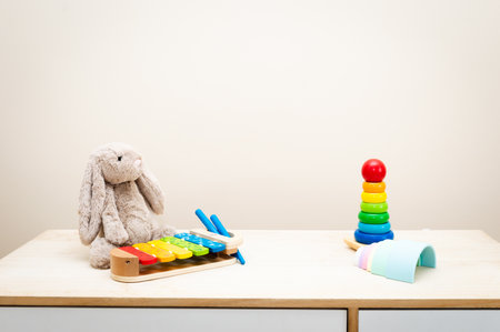 Background of Colorful Children's toys against the wall Toys on Wood Table with Copy Space for Textの写真素材