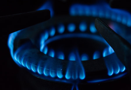 A Macro Image of a Blurry Blue Flames on Gas Stove Burner.の写真素材