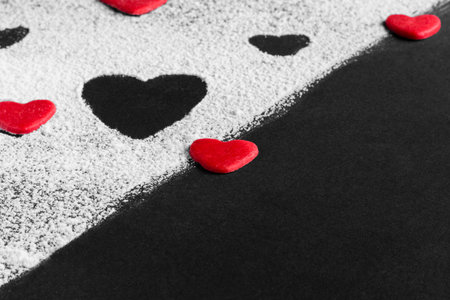 red heart on a black and white background on a diagonalの写真素材