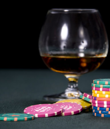 Glass with cognac and chips for a game in a casinoの写真素材