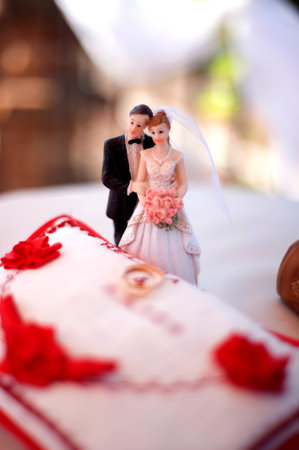Dolls of the groom and the bride for wedding cakeの写真素材