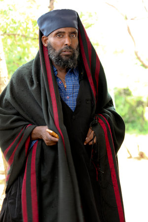 TURMI, ETHIOPIA - NOVEMBER 22, 2011: The priest from the Ethiopian orthodox church. November 22, 2011 in Turmi, Ethiopia.のeditorial素材