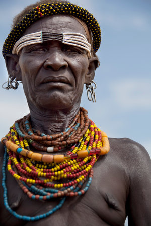 SOUTH OMO - ETHIOPIA - NOVEMBER 23, 2011: Portrait of the unidentified old woman from the African tribe Dasanech, in November 23, 2011 in Omo Rift Valley, Ethiopia.のeditorial素材