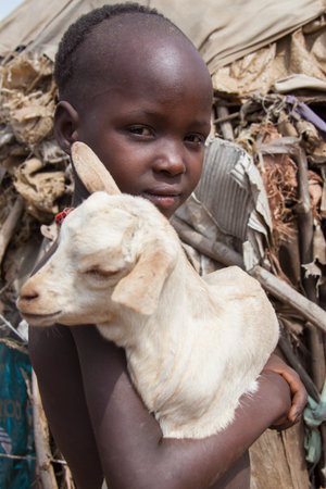 SOUTH OMO - ETHIOPIA - NOVEMBER 23, 2011: Portrait of the unidentified boy from the African tribe Dasanech, in November 23, 2011 in Omo Rift Valley, Ethiopia.のeditorial素材