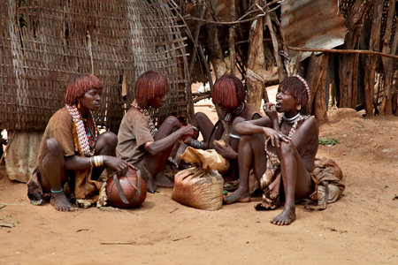 OMO VALLEY, ETHIOPIA - NOVEMBER 22, 2011: Hamers in the Turmi market, the ethnic groups in the Omo valley on November 22, 2011 in Omo Valley, Ethiopia.のeditorial素材