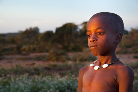 SOUTH OMO - ETHIOPIA - November 23, 2011: Unidentified Hamer boy on November 23, 2014 in South Omo, Ethiopia. The boy's portrait from a tribe a hamer, Ethiopia.のeditorial素材