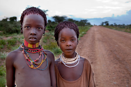 SOUTH OMO - ETHIOPIA - November 23, 2011: Unidentified Hamer girls on November 23, 2014 in South Omo, Ethiopia. The girlss portrait from a tribe a hamer, Ethiopia.のeditorial素材