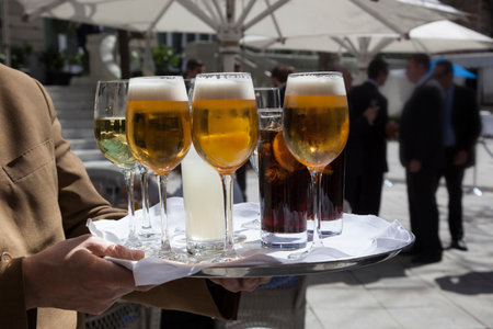 Professional catering service serving drinks to guests.の写真素材