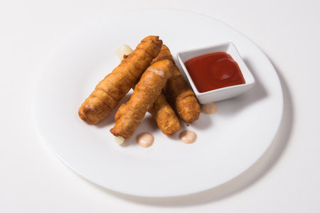 Latin-American appetizers called Tequenos made of fried corn filled with cheese