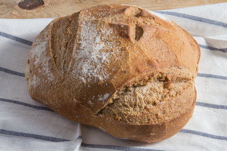 Closeup of traditional bread with eco ingredients with crispy crust