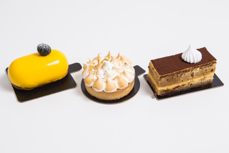 Set of puffed cakes with different ingredients on white backgroundの写真素材