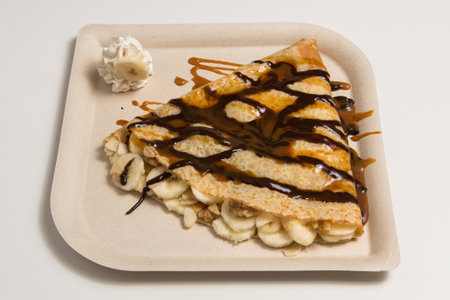 A crepe with sweet banana on white backgroundの写真素材
