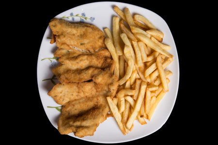 Fried chicken and french fries . Potatoes and chicken fries.の写真素材