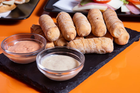 Latin-American appetizers called Tequenos made of fried corn filled with cheese