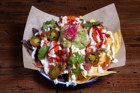 Beef and cheese corn nachos served on a big plate ready to eat.の写真素材