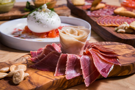 Spanish style Iberico ham serve like a flower on a wood tableの写真素材