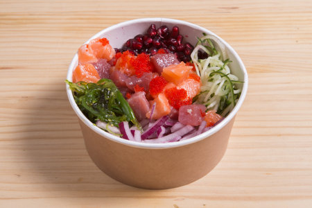 Poke with avocado, tuna, salmon, cucumber, pomegranate.の写真素材