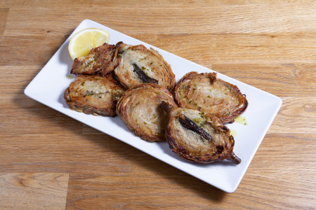 Zarajos to eat on a white plate, traditional food from Cuenca, Spainの写真素材