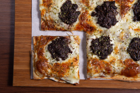 Rectangular pizza wuth morcilla and cheese. pinzza.の写真素材