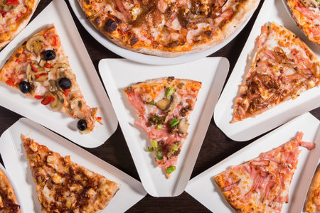 Background Pizza. Set of delicious pizzas with bacon, cheese and mushrooms. top viewの写真素材