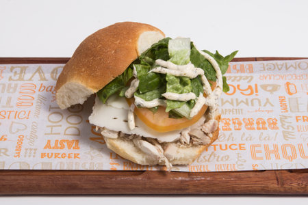 Fresh tasty burger on wooden board, fast foodの写真素材