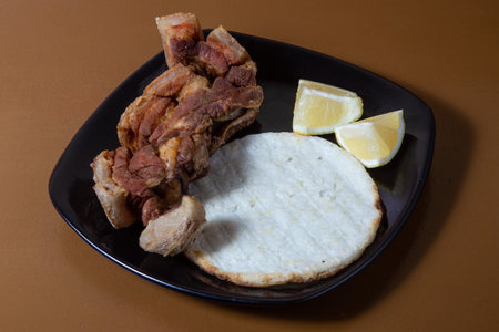 Colombian food, Chicharron fried pork with arepaの写真素材