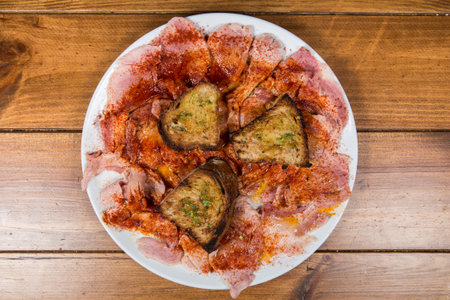 Some slices of lacon, typical ham of Spain, with paprikaの写真素材