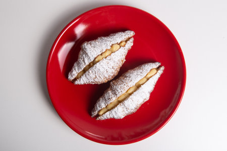 Croissant with blancmange cream stuffed, strawberry jam and dust sugarの写真素材