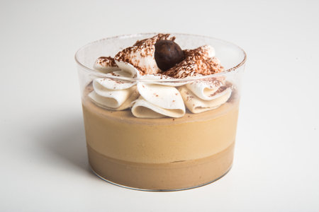 Mouse with chocolate in small glass cupの写真素材