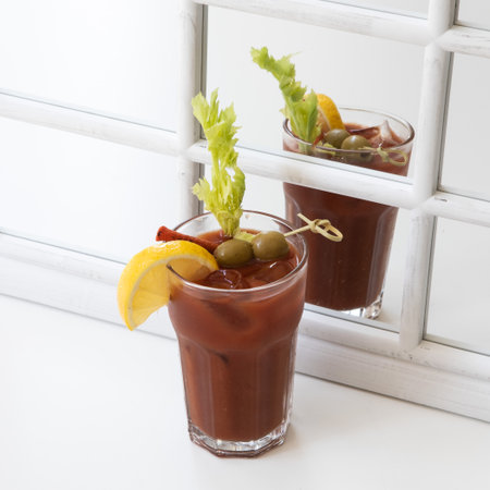 Bacon Spicy Vodka Bloody Mary with Tomatoes, Olive and Celeryの写真素材