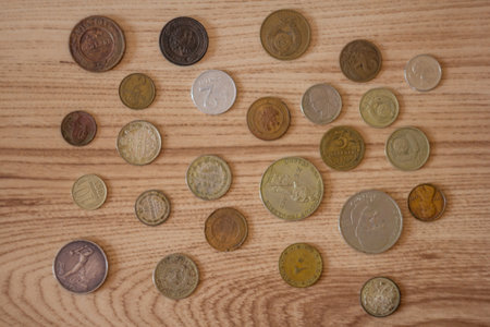 Covers ancient coins on a wooden backgroundの写真素材